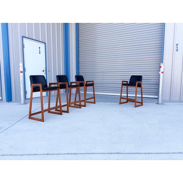 ✨ Mid-Century Modern Teak Bar Stools, Set of 4 ✨ This stunning set of four mid-century modern bar stools was designed and...