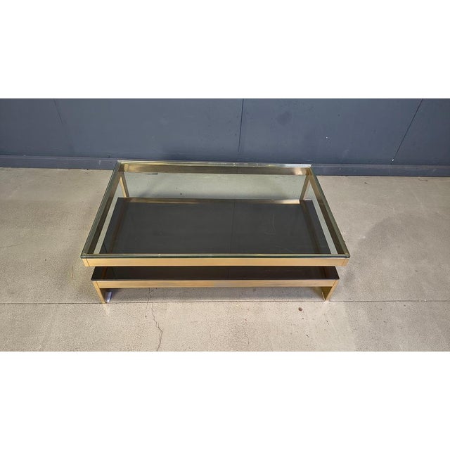 Quality 23kt gold layered and thick clear glass two tier coffee table manufactured by Belgochrom. This table is a popular...