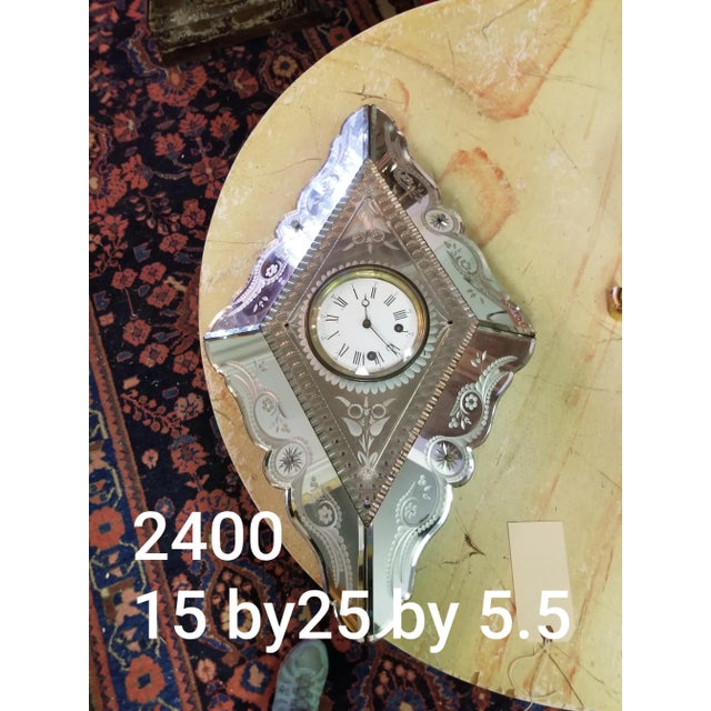 Antique Venetian clock that has been converted to battery. This has beautiful etched mirrored panels and wonderful aged...