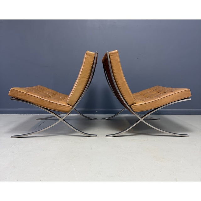 A rare and desirable pair of early Barcelona chairs designed by Ludwig Mies van der Rohe and produced by Knoll during the...