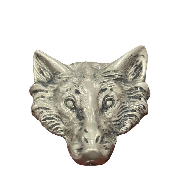 A distinctive vintage Gucci figural bottle opener designed as a sculptural fox head. The piece features an elongated...