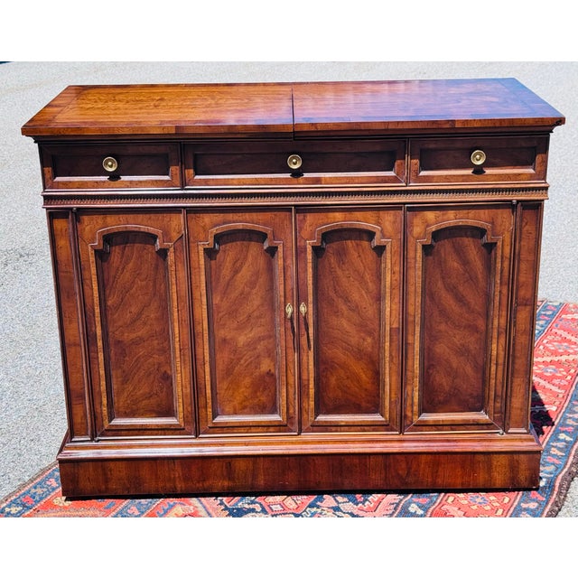 Bring mid-century sophistication and timeless functionality into your home with this stunning 1960s dry bar server by...