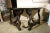 Beautiful pair of carved, walnut demilune tables or can be combined to create a single, center table. The thick, polished...