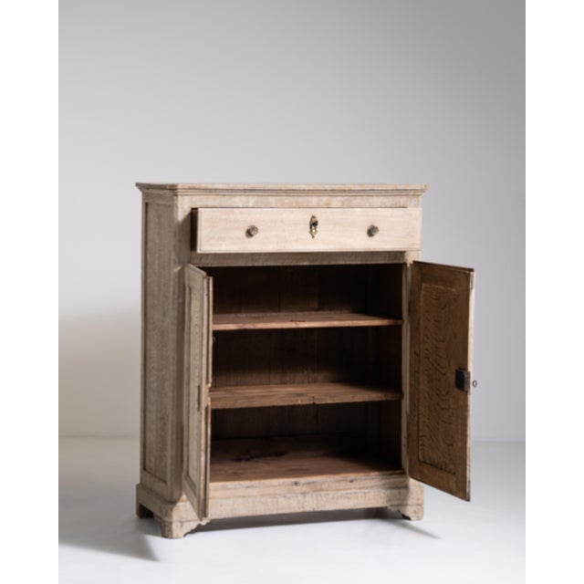 A distinguished example of 19th-century French craftsmanship, this oak buffet reflects the robust yet refined sensibility...