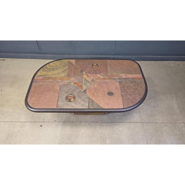 Brutalist slate and natural stone top coffee table with inlaid copper and brass. Stone base The table is signed but we...