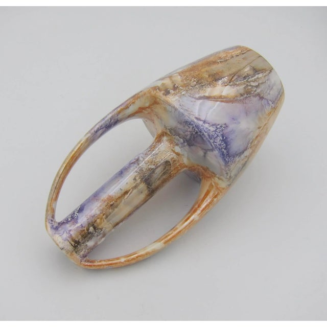 A Scandinavian art pottery vase with a Loistomarmori marbled luster glaze from the Arabia Porcelain Factory of Helsinki,...