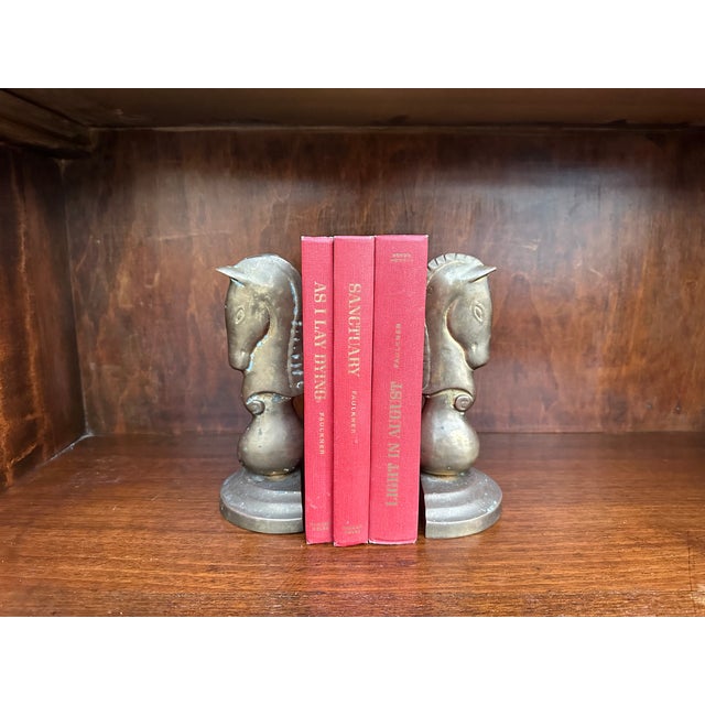 This is a very unique set of mid century Hollywood Regency style brass Horse Head bookends. They are in a very Jonathan...