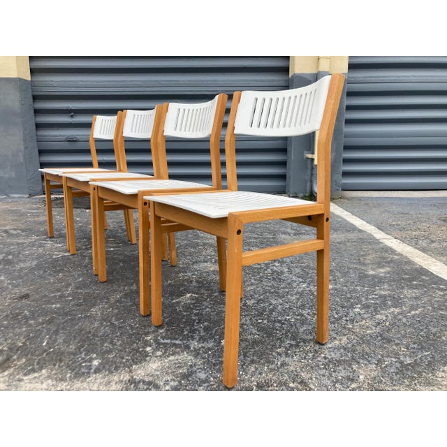 Set of Four Designer Dining Chairs. Bentwood seats and backs. Interesting design, matching dining table available. Ready...