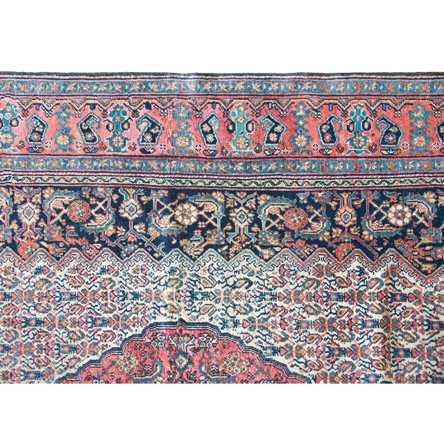 A beautiful early 20th century Persian Bibikibad rug with a large floral patterned medallion living amidst a field of more...