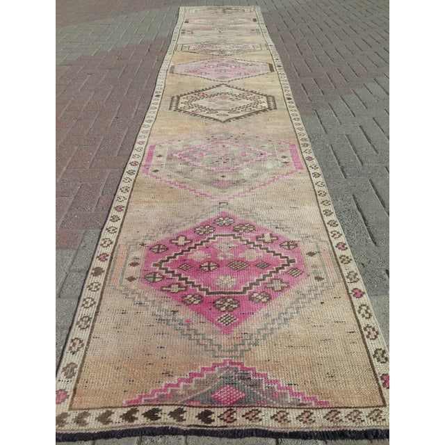The Runner Rug you are about to purchase is a Vintage Handmade Turkish Rug that is considered a collection piece due to...