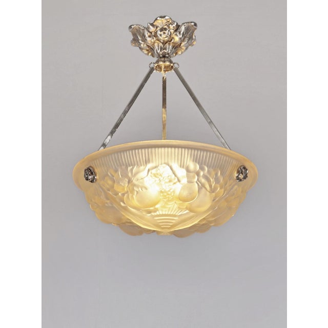 MULLER FRERES A French 1925-1930 art deco pendant light in nickel plated solid brass or bronze holding a beautiful Muller...