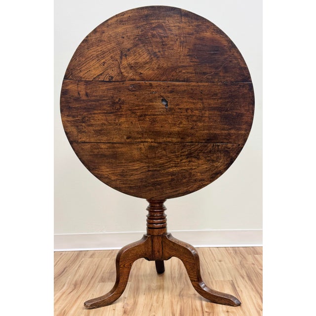 Antique 18th C English walnut tilt-top tea table. Round board top above tripod cabriole base with turned column. Stunning...
