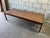 Striking Danish Mid-Century Modern coffee table, circa 1960s, crafted from richly figured solid rosewood and topped with a...