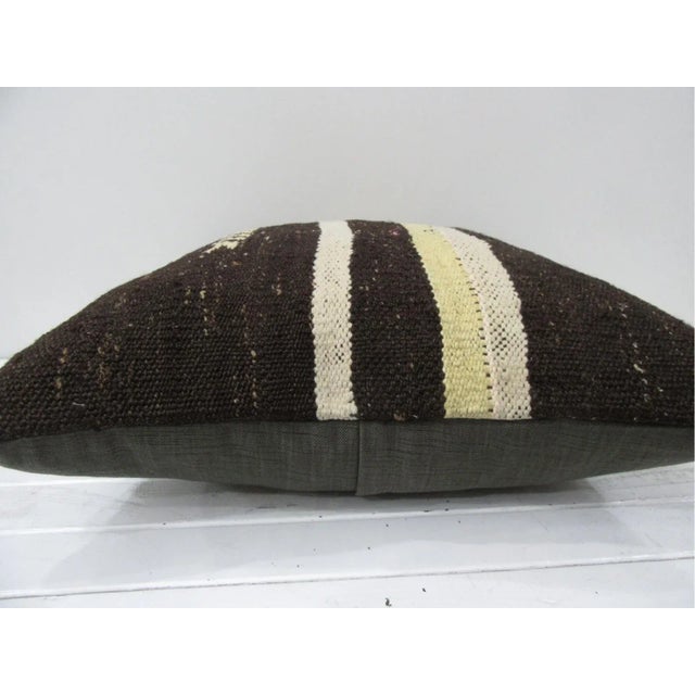 This is a pillow cover made from a vintage kilim rug. The piece was properly washed and ready to use. Pillow inserts not...