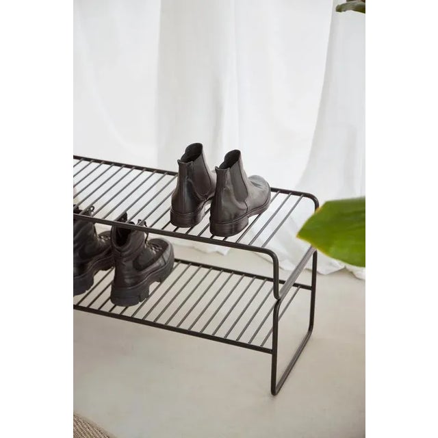 Black Metal Shoe Racks by Cuero Design Dimensions: D 31,3 x W 71 x H 40 cm. Materials: Metal.