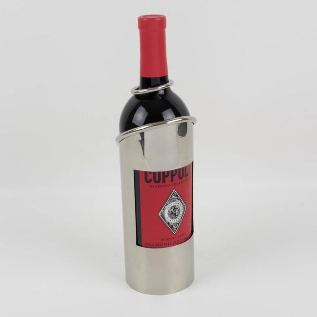 French 1980s bottle holder. This wine pourer or server is in chromed metal with a streamlined design. No visible maker's...