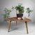 Vintage wooden coffee table, probably originating from Belgium. The table features an organically shaped top with soft,...