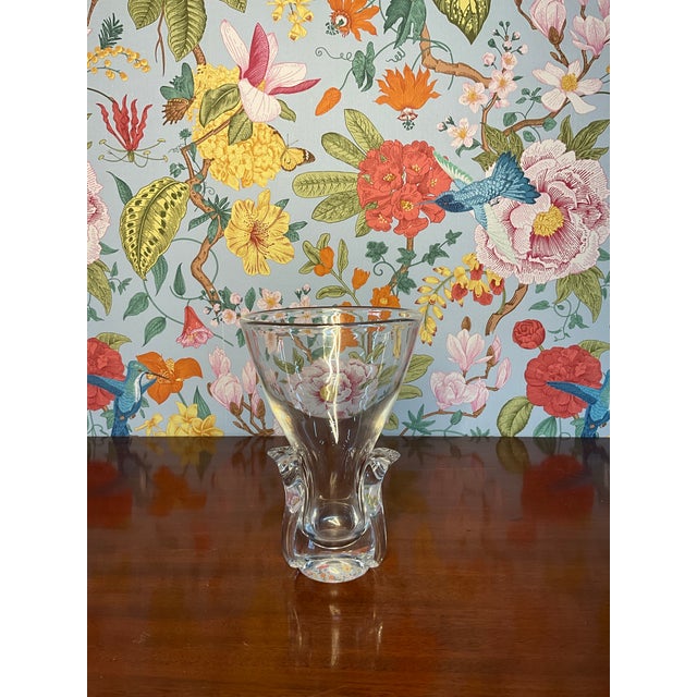 This Steuben flower vase is perfect for all occasions. There is an orange stain on the inside of the vase.