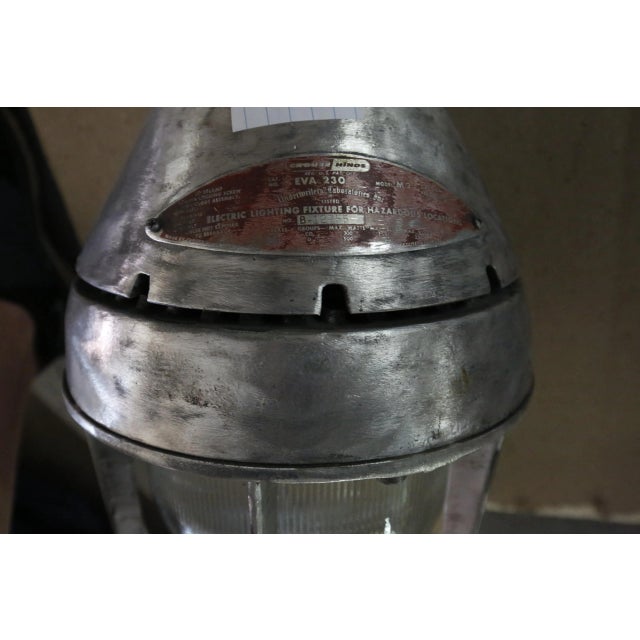 Vintage industrial pendant light. Crouse-Hinds Vaporgard luminary featuring a fluted tempered glass globe.