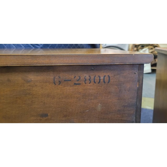 Pair of continental style vintage 1950s nightstands or end tables made by Henredon Furniture Company. Each features two...