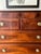 19th C George III Mahogany Chest with Four Drawers. The chest has flamed mahogany drawer fronts and banded top with string...
