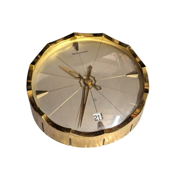 A very elegant desk clock with date display from the 1960s. Executed by Jaeger Le Coultre, Switzerland. Ref. 362. The...