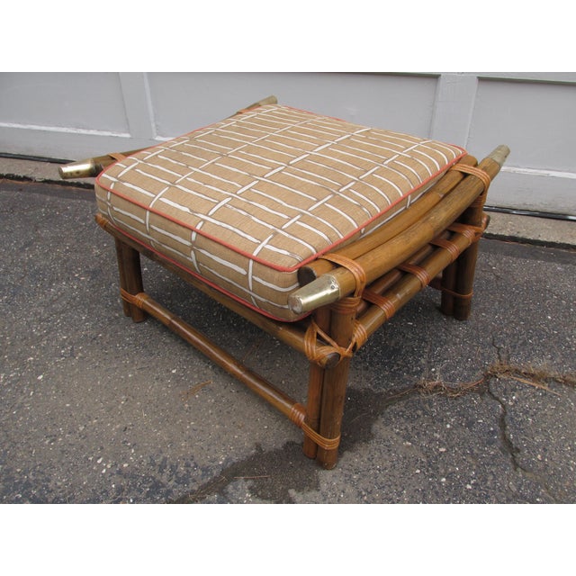 Vintage 1960s ottoman in the style of Ficks Reed's Far Horizons line of furniture. Constructed of bamboo and rattan with...
