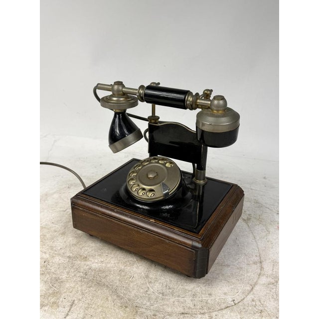 Beautiful rotary telephone made of wood and brass, ideal for collectors or as a decorative object to create a nostalgic...