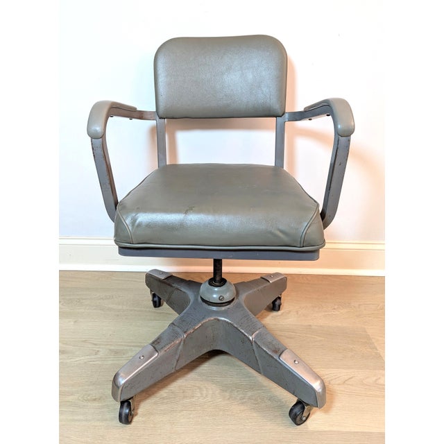 Authentic mid-century modern heavy-duty industrial swivel office chair with arms. Manufactured in September 1967 by...