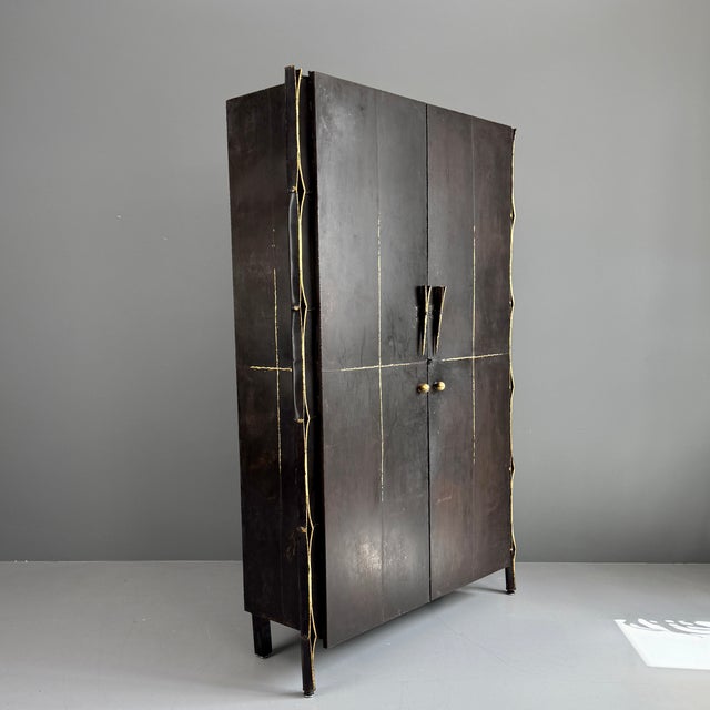 Unique sculptural wrought iron cabinet. Made by the goldsmiths 'Les Millionnaires' in Zurich in 1995. Very heavy to...