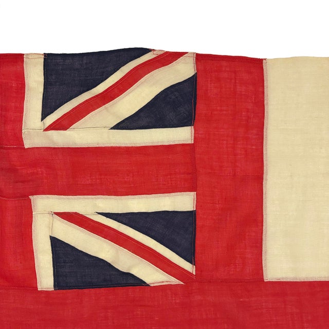 This vintage British White Ensign flag is made from a sheer woolen cloth in yellowed off-white, with fully sewn design...
