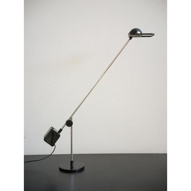Maniglia table lamp designed by Jonathan De Pas, Donato D'Urbino and Paolo Lomazzi for the Italian lighting manufacturer...
