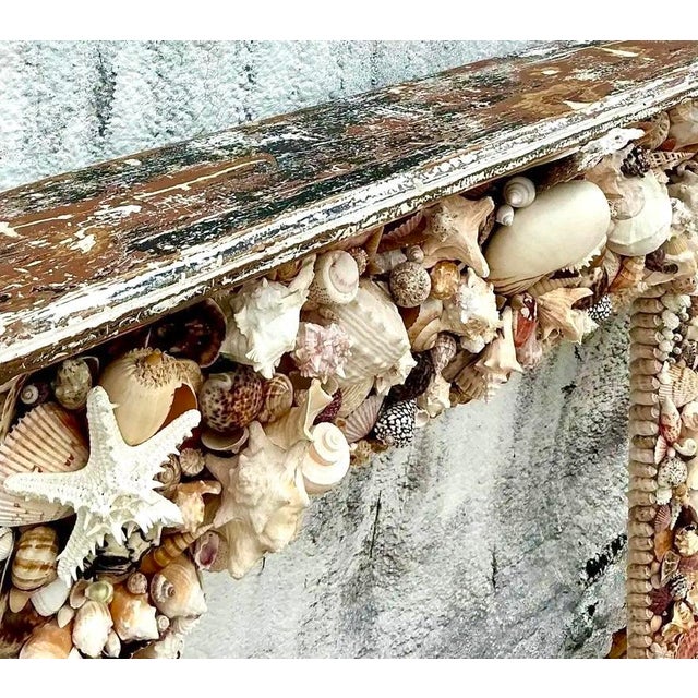This extraordinary vintage fireplace surround is a captivating masterpiece of coastal artistry, perfect for the discerning...