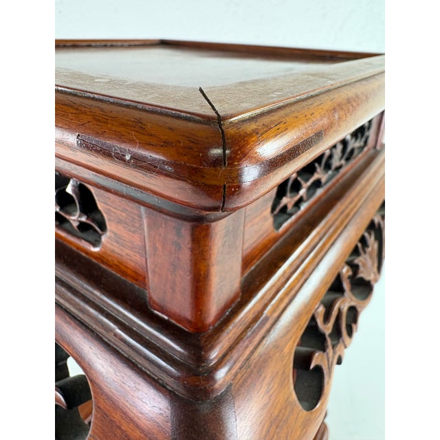 This is a late 20th century Chinese export mahogany hand carved pedestal table. The small pedestal table has beautiful...