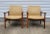 Pair of solid teak lounge side chairs designed by Alf Svensson for Dux circa 1960s. This pair has a vintage woven...