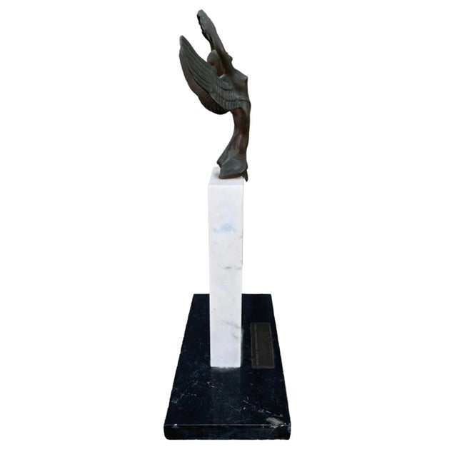 Vintage sports trophy from Campos De Jordão Brazil. Depicts a winged figure raising a victory wreath set atop a granite...