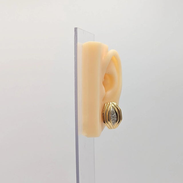 Beautiful earrings with 0.40 ct. white diamond rounds in handmade 14k white and yellow gold mountings. Push back with...