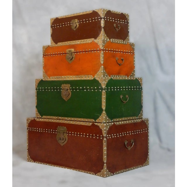 Circa 1980's brass nail head nesting blanket storage trunks. Each is beautifully hand crafted in wood with felt lining....