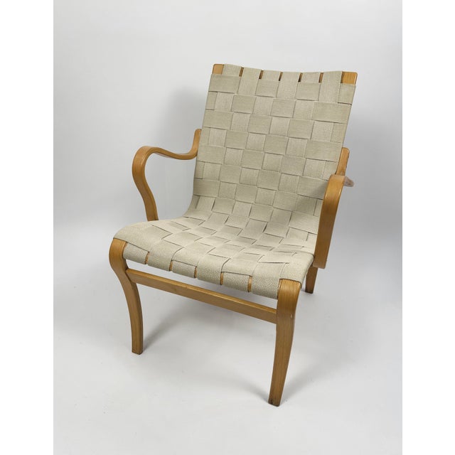 Designed by bruno mathsson, the eva chair is a landmark of scandinavian modernism, celebrated for its ergonomic comfort...