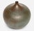 Gertrud and Otto Natzler Round Bottle with Lip, 1967 Earthenware with a special Steel Blue matte glaze, showing subtle...