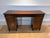 This, circa 1820, English regency mahogany sideboard stands on saber legs. Uppercase consists of solid mahogany and...