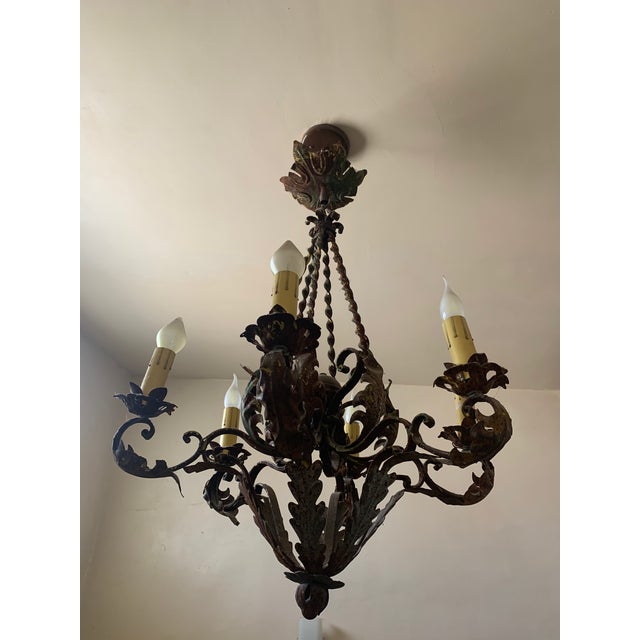 Beautiful and timeless design, crafted from hand-forged iron. Features six gracefully curved arms and working bulbs in...