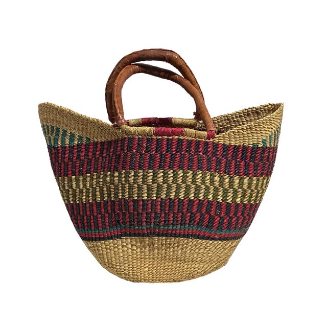 This African Bolga Basket from the Bolgatanga region of Ghana, inspired by Saint-Tropez French Riveria town, is of...