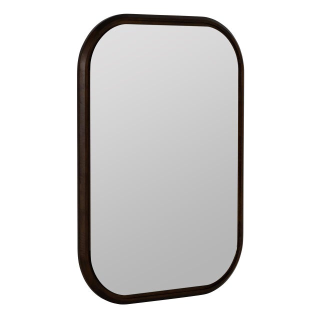 The Jude Wall Mirror features a sleek dark rubber wood frame with clean, architectural lines and a rich espresso finish....