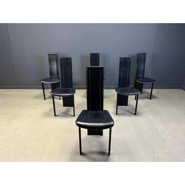 Set of 6 black italian leather high back dining chairs. beautiful sleek and timeless design. The chairs are in good...