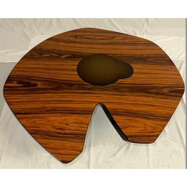 This organic wood topped coffee table was purchased from Luxury Living, a Miami based design firm showcasing luxury...