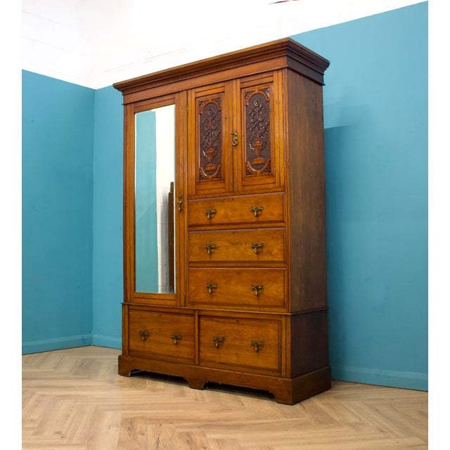 A well-proportioned Edwardian walnut compactum wardrobe, combining hanging space, drawers and shelving in one practical...