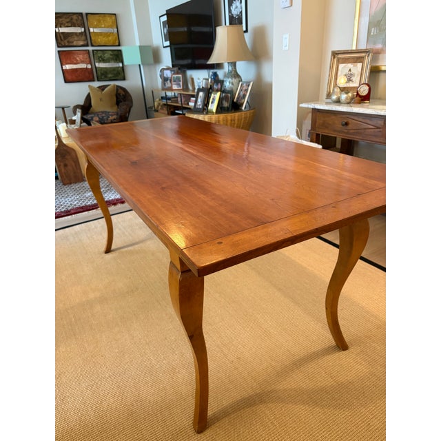 Beautiful French antique reproduction dining table crafted in wood and finished with a unique hand applied French Wax...