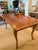 Beautiful French antique reproduction dining table crafted in wood and finished with a unique hand applied French Wax...
