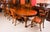This is a fabulous antique Queen Anne Revival burr walnut dining table by the renowned retailer and cabinet maker Maple &...